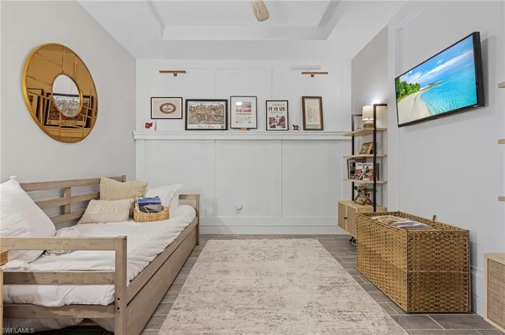 Living room featuring a tray ceiling
