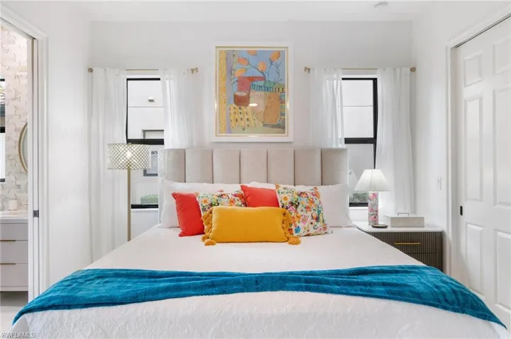 Bedroom with multiple windows
