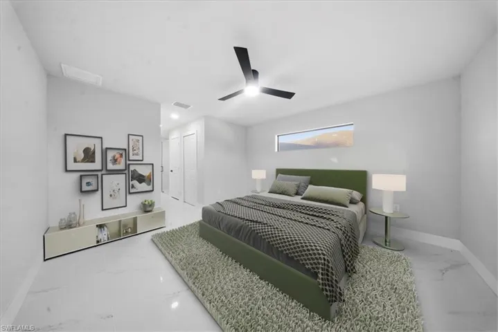Bedroom featuring marble look tile flooring, a ceiling fan, and a closet