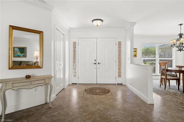 The welcoming foyer opens to bright living spaces.