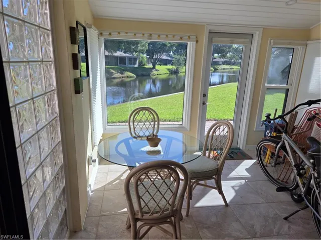 Sunny bonus waterfront Florida room with all new, high-end windows off the Kitchen.