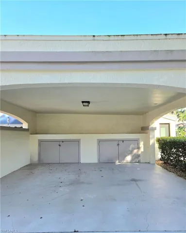 Covered carport with extra storage.