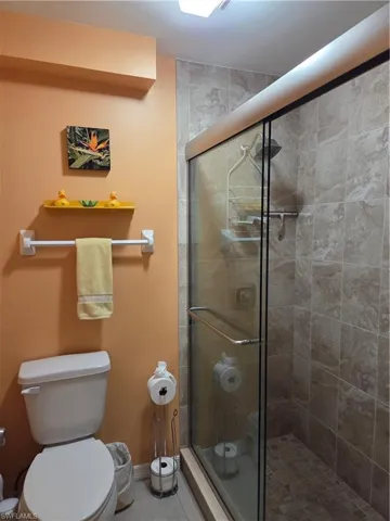 Primary bathroom with tile shower.