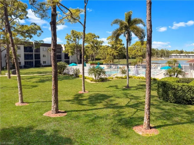 View of home's community with a swimming pool