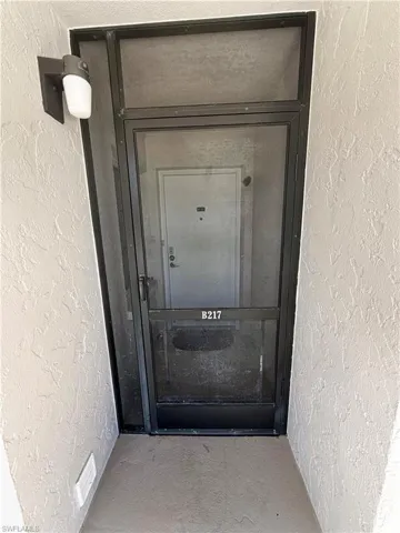View of exterior entry featuring crawl space