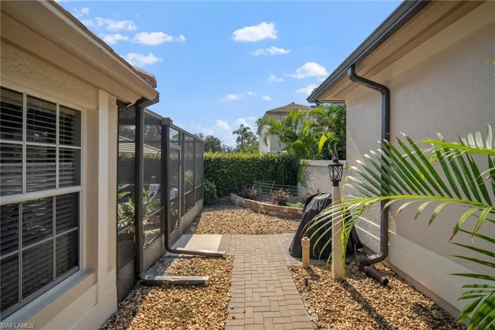 View of yard with glass enclosure