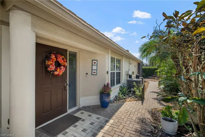 Property entrance featuring a patio area and central AC unit