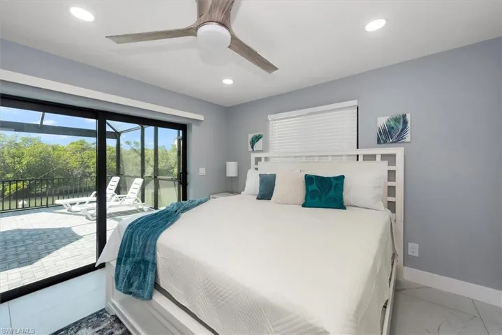 Bedroom featuring access to exterior, recessed lighting, baseboards, ceiling fan, and light marble finish floors