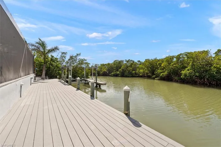 Dock area featuring a water view and boat lift