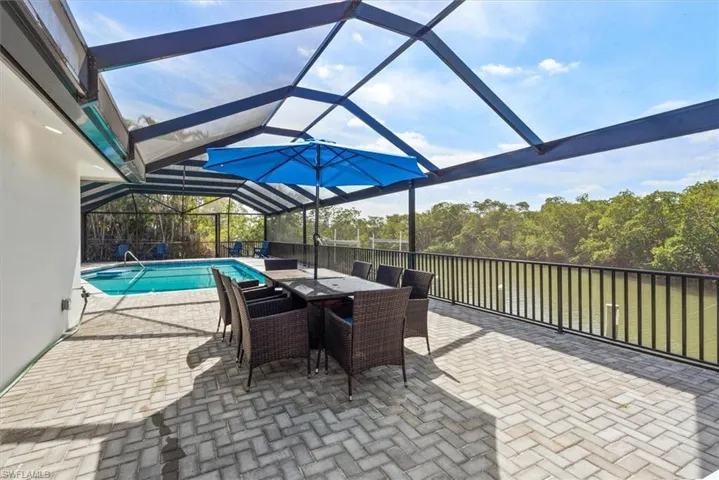 View of patio with a lanai