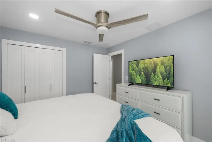 Bedroom with ceiling fan, a closet, and recessed lighting