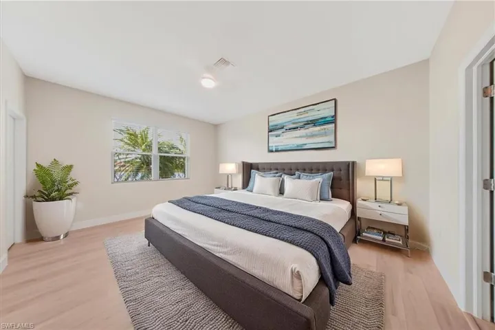 Virtual staging-Bedroom featuring baseboards and light wood finished floors