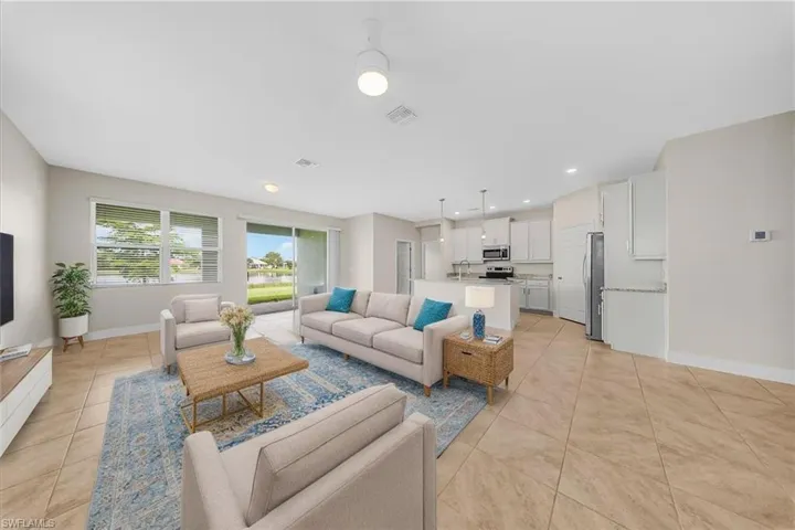 virtual staging-Living area featuring recessed lighting and light tile patterned flooring