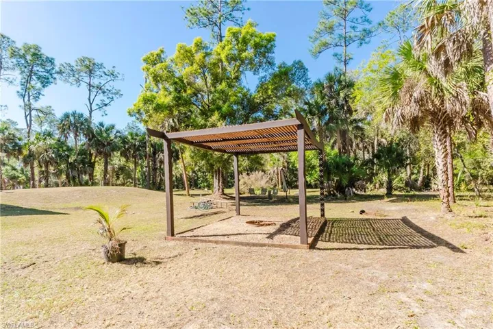 View of back yard with a pergola