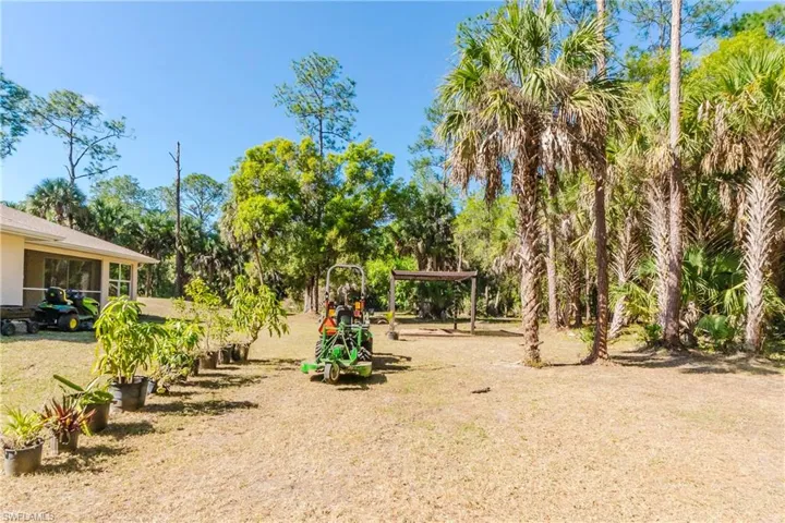 View of yard featuring a pergola and room to add a pool