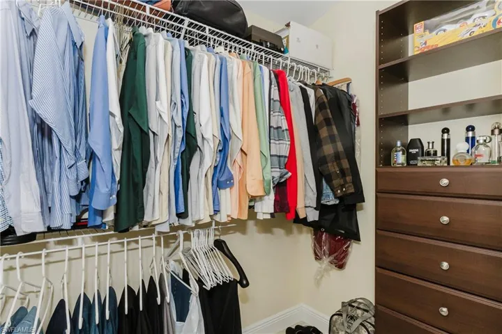 Two master bedroom walk-in closets with built-ins
