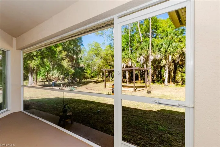 Unfurnished screened lanai with healthy amount of natural light