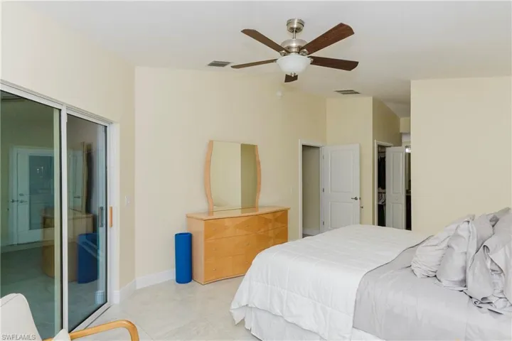 Master Bedroom with a ceiling fan and access to outside
