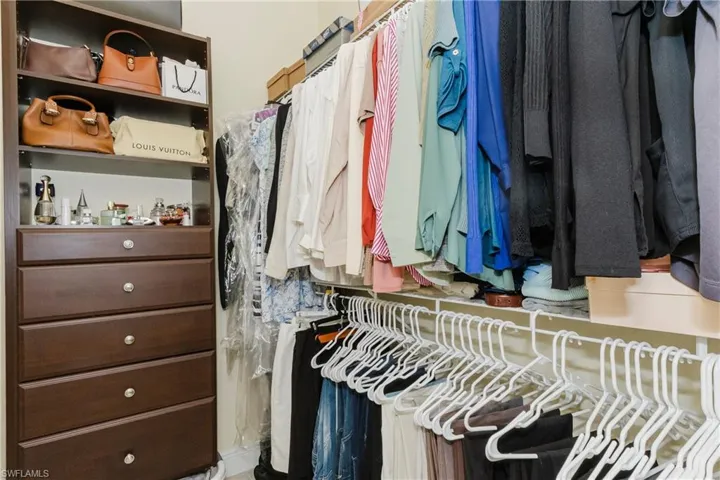 Two master bedroom walk-in closets with built-ins