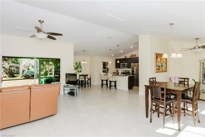 Open living area, and high ceilings.