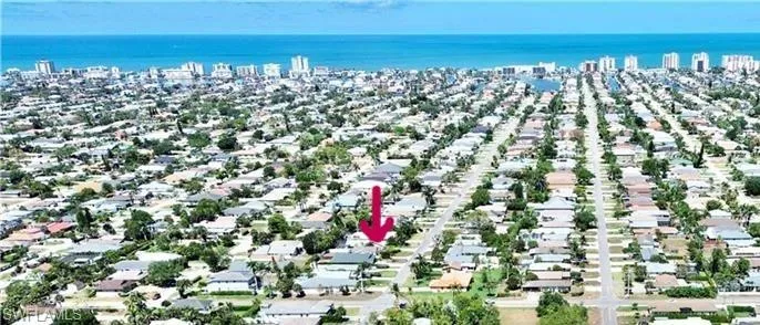 View of urban area featuring nearby suburban area and a large body of water