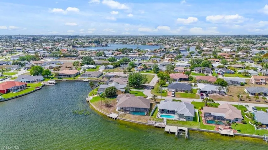 Aerial view of residential area with a nearby body of water