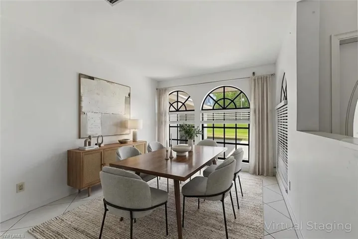 Dining room with light tile patterned flooring