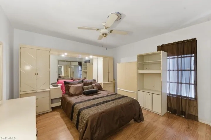Bedroom featuring light wood-style flooring and a ceiling fan