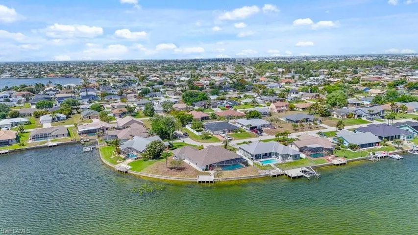 Aerial view of residential area with a nearby body of water
