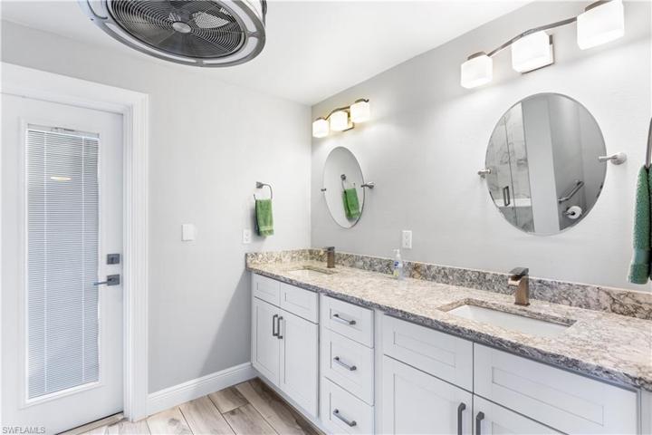 Dual Vanities, door to the Lanai/pool area