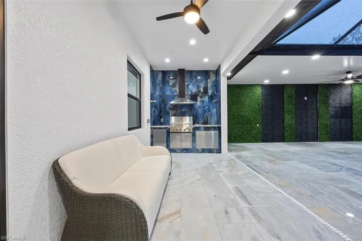 View of patio / terrace with exterior kitchen and a ceiling fan