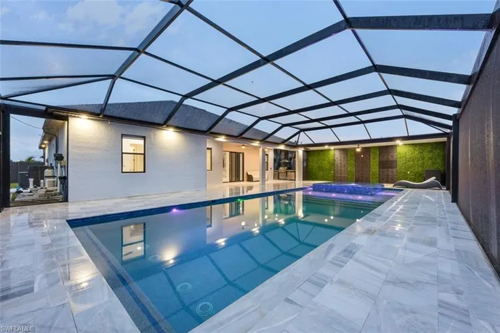Pool featuring a patio and a lanai
