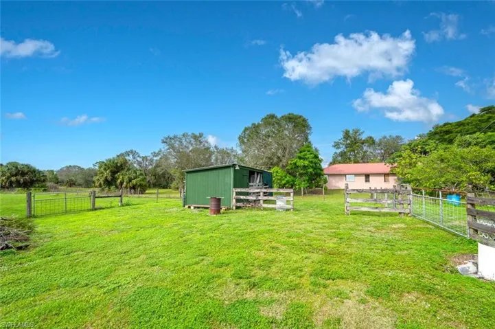 View of yard with and barn