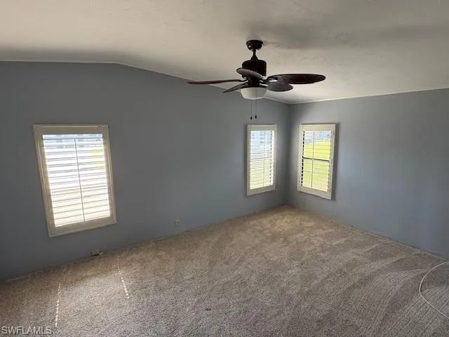 Master bedroom with new carpet and a new ceiling fan