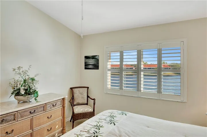 Bedroom featuring vaulted ceiling