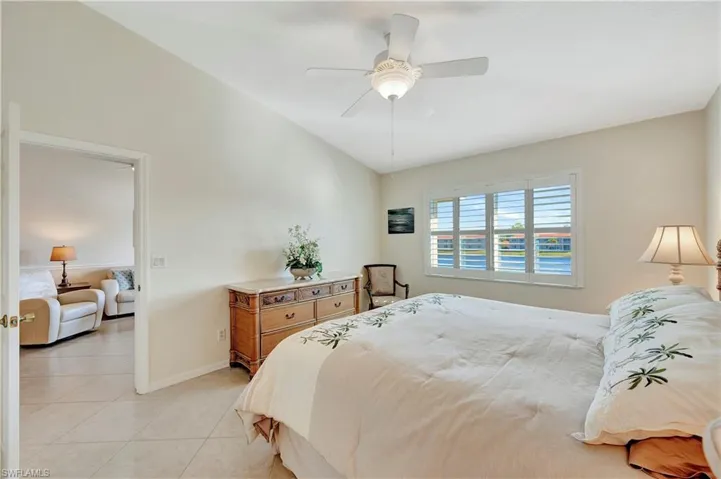 Tiled bedroom with ceiling fan
