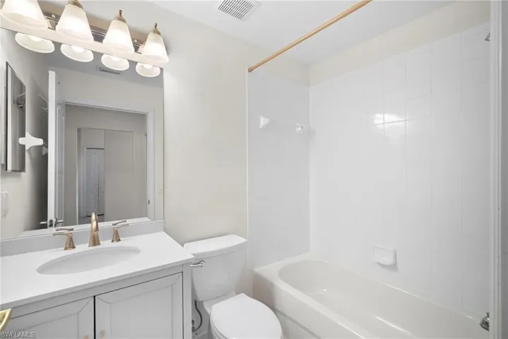 Bathroom with vanity and shower / bath combination
