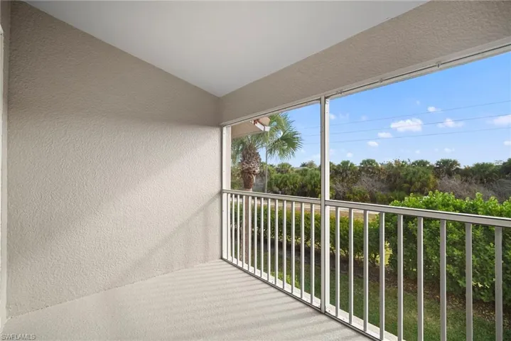 Balcony featuring a sunroom