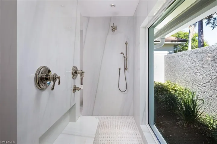 Full bathroom featuring a walk in shower