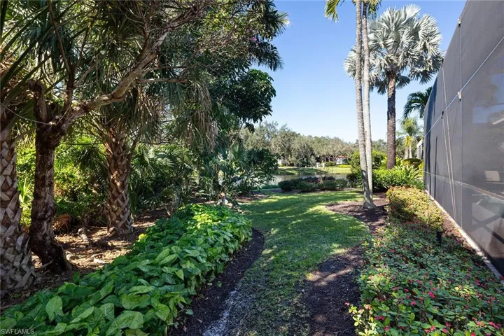 View of green lawn with glass enclosure