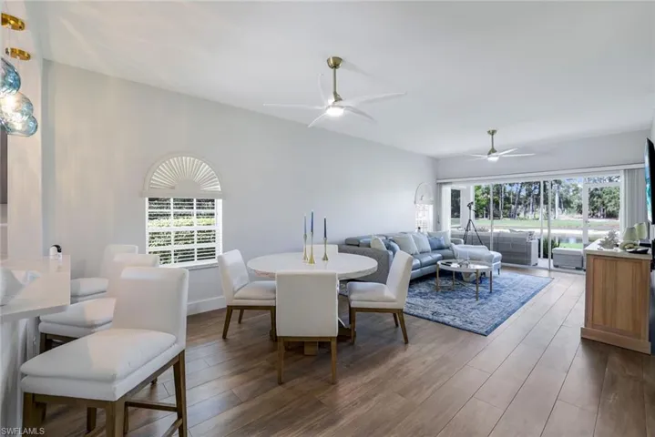 Dining space featuring wood finished floors and ceiling fan