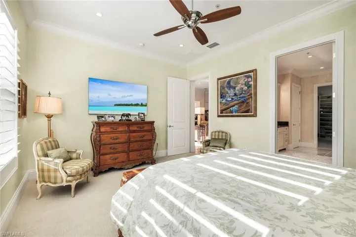 Bedroom with crown molding, light carpet, ceiling fan, and recessed lighting