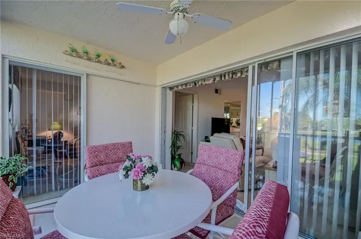 Sunroom featuring ceiling fan