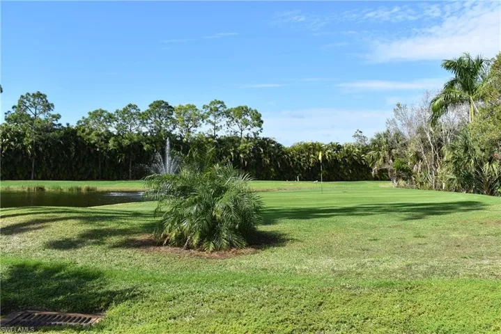 View of yard with a water view