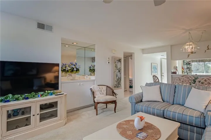 Living room featuring light carpet