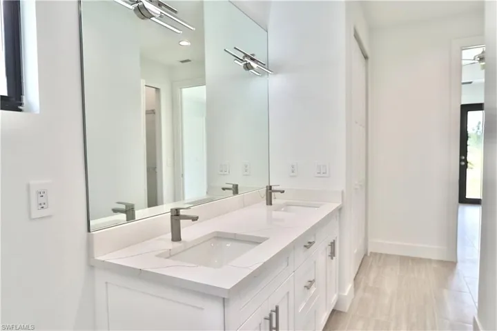 Main Bathroom featuring double sink vanity