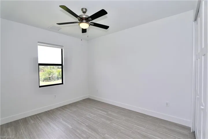 4th Bedroom featuring ceiling fan and a closet