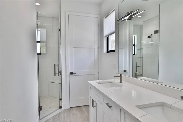 Main Bathroom with shower, dual vanity and private water closet