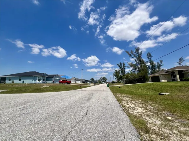 View of asphalt road with a residential view