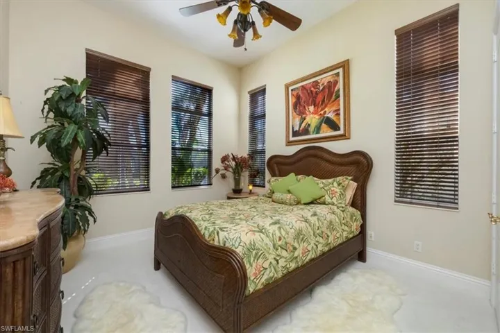 Bedroom with baseboards and a ceiling fan